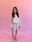 Pink floral matching skort and pullover set — a cute and comfortable outfit perfect for travel, a day out, or everyday wear