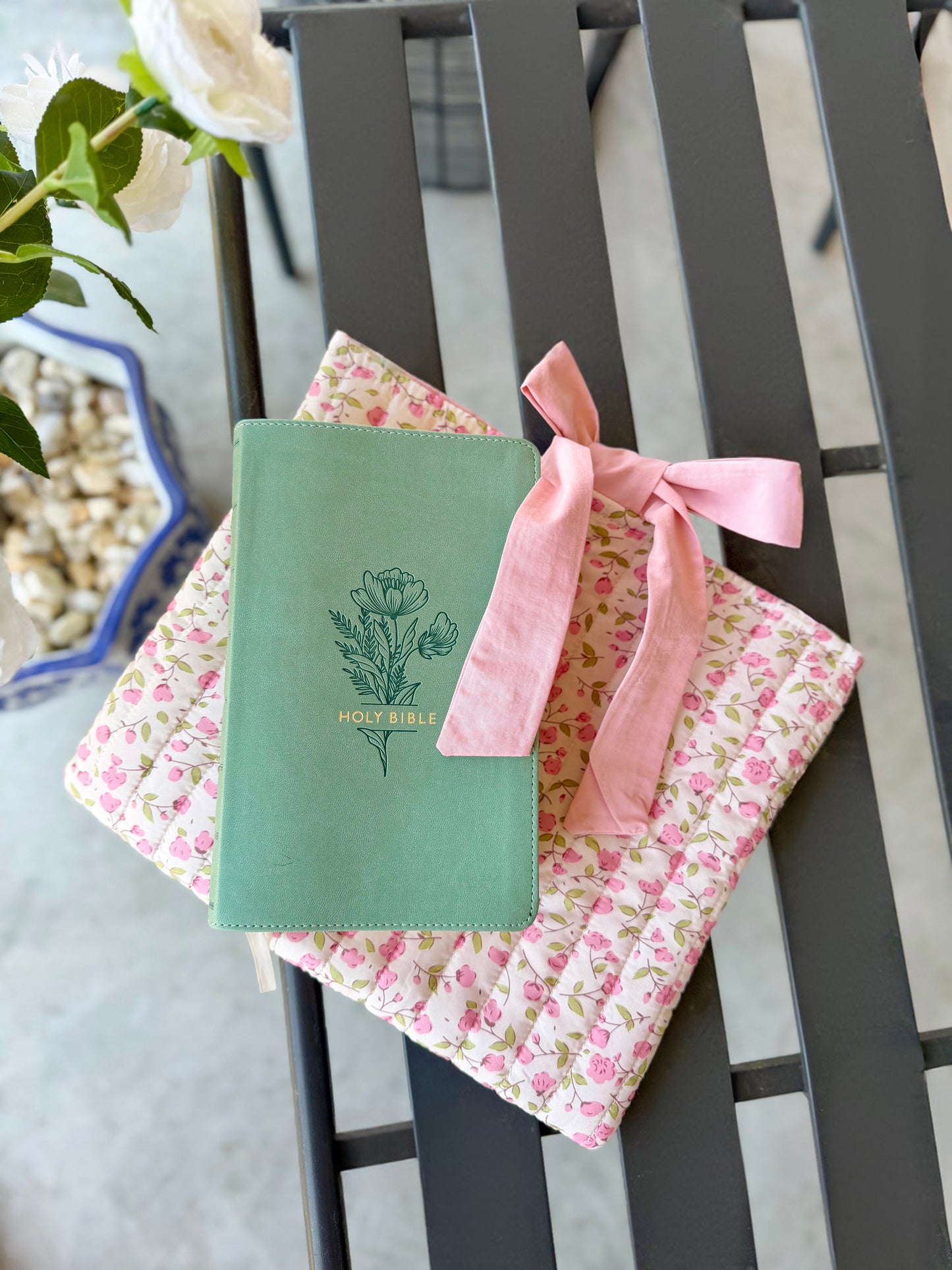 Pink quilted floral Bible cover with bow tie closure — a beautiful and practical accessory for your Bible or a thoughtful gift