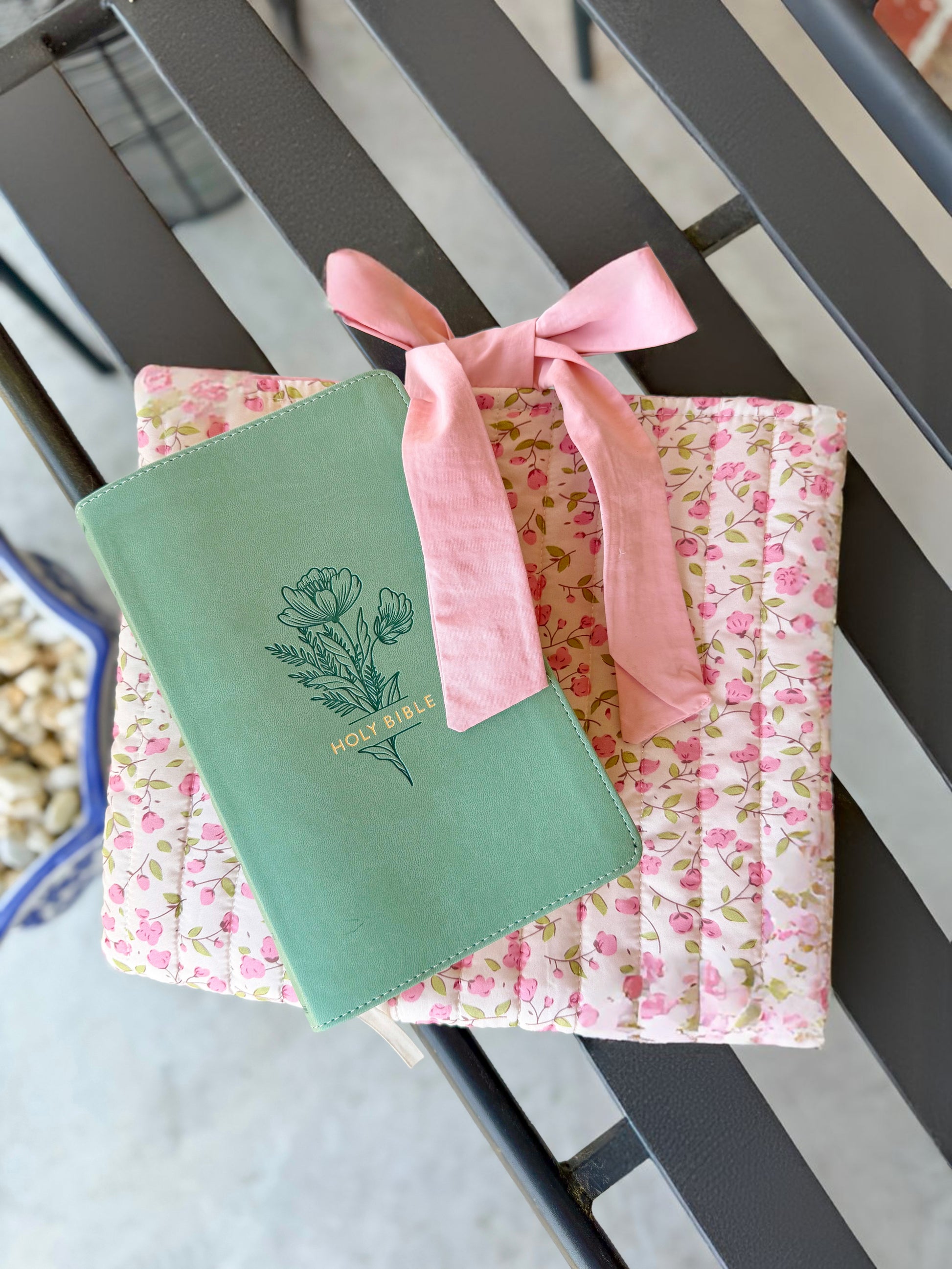 Pink quilted floral Bible cover with bow tie closure — a beautiful and practical accessory for your Bible or a thoughtful gift