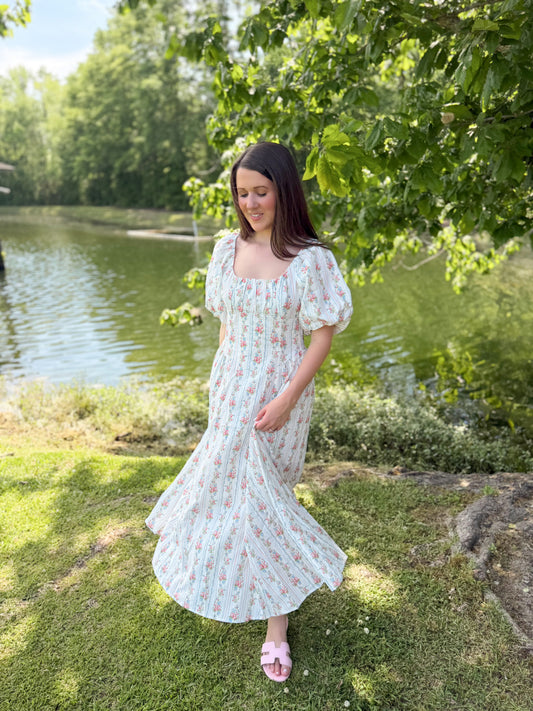 Whimsical pastel floral smocked dress, perfect for church, bridal showers, or a night out.