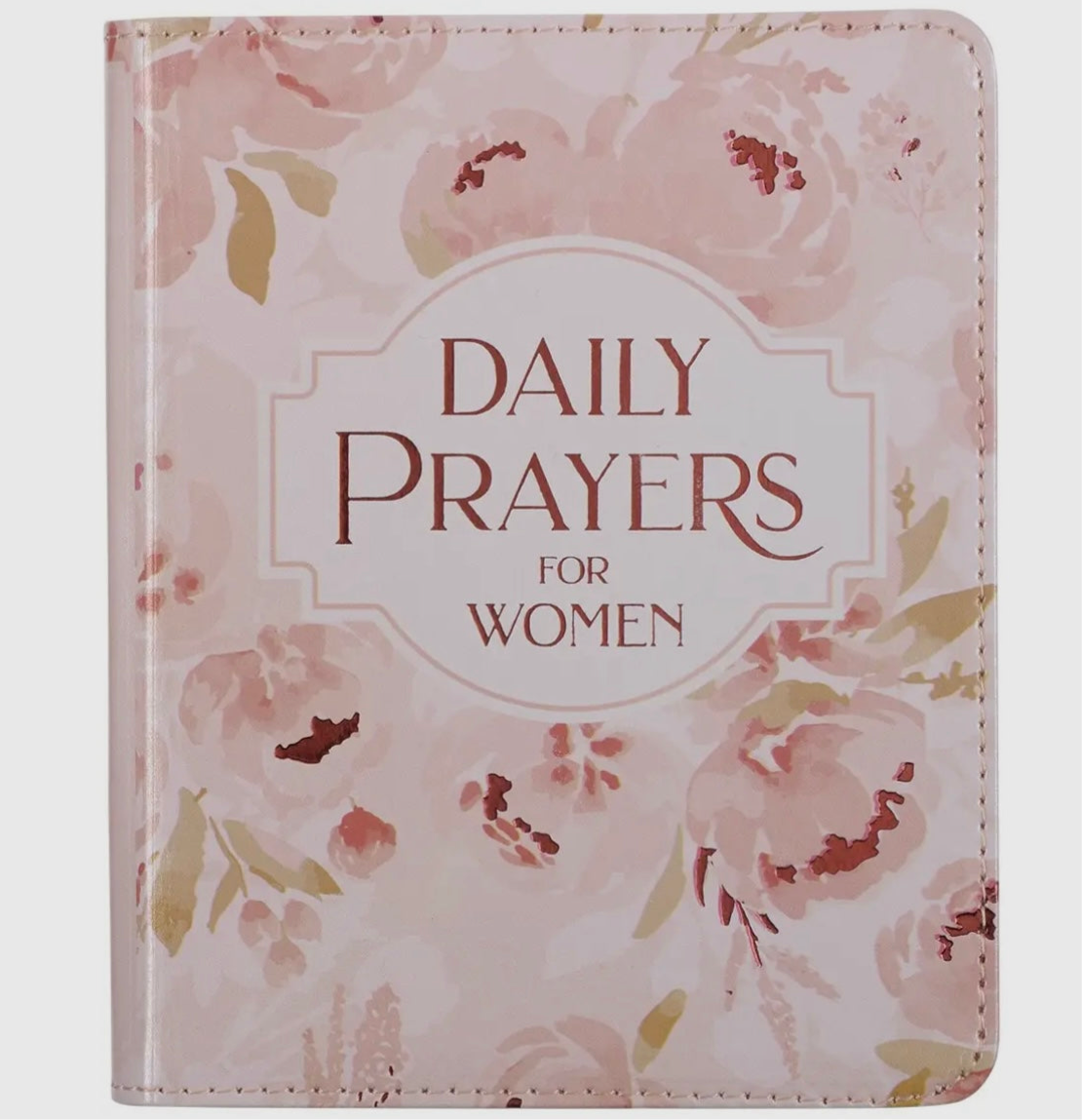 Pink floral hardcover book titled Daily Prayers for Women, featuring soft pastel flower designs