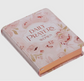 Pink floral hardcover book titled Daily Prayers for Women with gold-edged pages