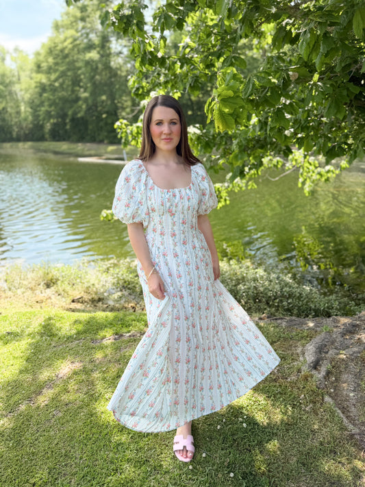 Whimsical pastel floral smocked dress, perfect for church, bridal showers, or a night out.