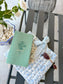 Blue quilted floral Bible cover with bow tie closure — a beautiful and practical accessory for your Bible or a thoughtful gift