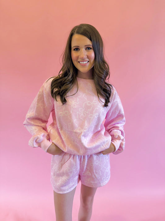 Soft and comfy pink bow sweatshirt and shorts set — perfect for dressing up for nights out or cozy stay-at-home days