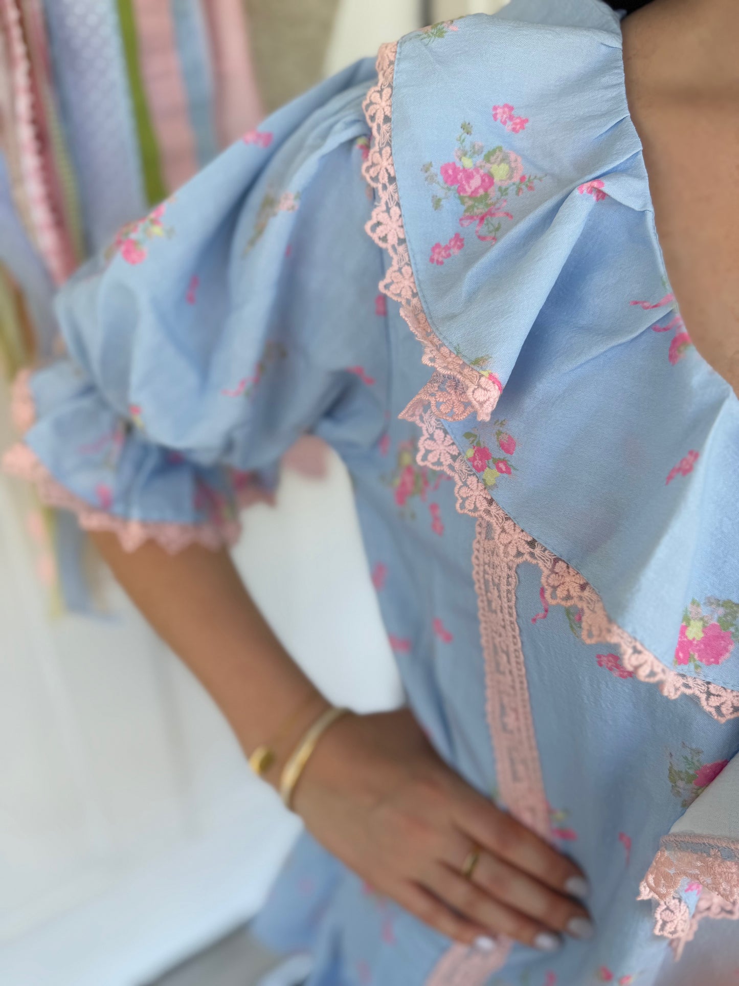 Blue and pink cotton ruffle neckline dress – a summer conversation starter.